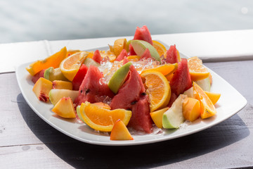 Delicious Fruit Salad with watermelon, oranges, kiwi and raisins
