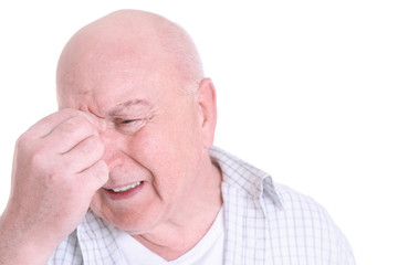 Mature man suffering from pain on white background