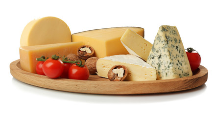 Board with assortment of delicious cheese, tomatoes and nuts on white background