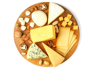 Wooden board with assortment of delicious cheese and nuts on white background