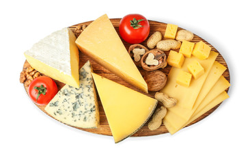 Board with assortment of delicious cheese, tomatoes and nuts on white background
