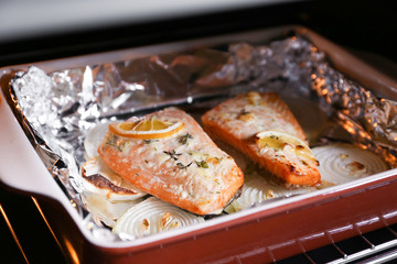 Baking dish with delicious roasted salmon fillet