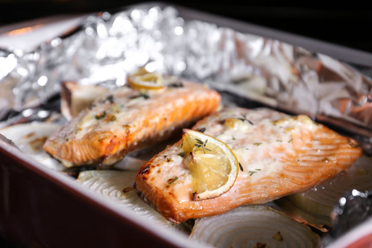 Baking dish with delicious roasted salmon fillet