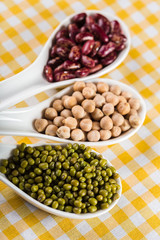 mix of beans on wooden table