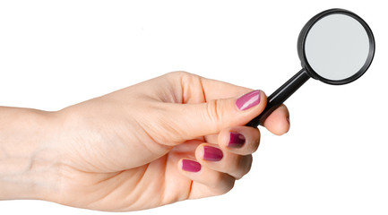 Hand holding magnifying glass isolated on white background