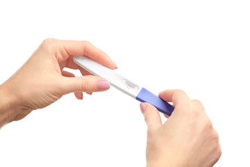 Pregnancy test in hands on white background