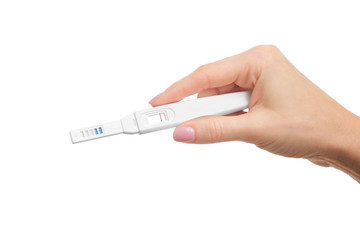 Fototapeta premium Pregnancy test in hand on white background