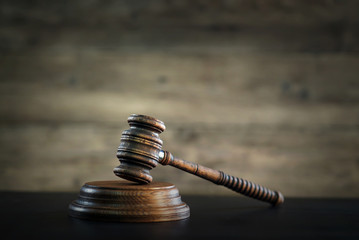 Law and Justice theme, gavel of the judge, wooden rustic desk