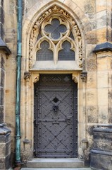 Fototapeta na wymiar Medieval front door in Prague, Czech Republic