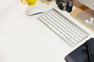 Hero Header Concept. Top view Designer stuff on White Desk with copy space for graphic or product montage.