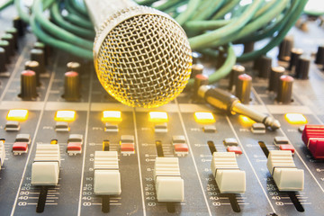 Closeup audio mixer slider in the control room.