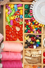 set of accessories and jewelry to embroidery, haberdashery, sewing accessories top view, seamstress workplace, many object for needlework, handmade and handicraft