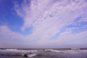 Blue sky ocean with clouds