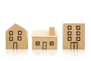 Miniature wooden houses on white background. Clipping paths included