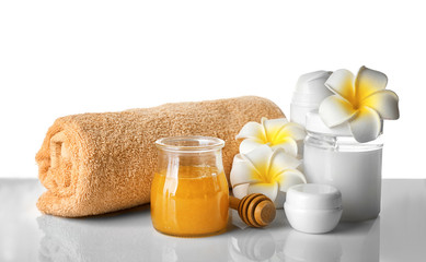 Beautiful honey spa composition on white background