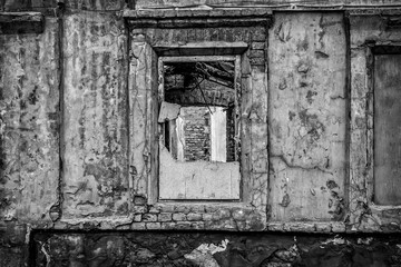 ruined house in a poor residential quarter in a slum. Noise and grain are added deliberately by a special filter.