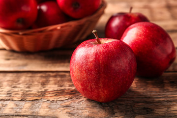 Fresh red apples on wooden background