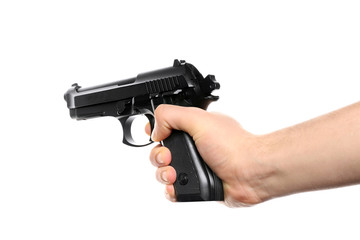 Man's hand holding gun on white background