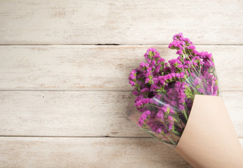 statice purple flower on wooden floor, Place for text.