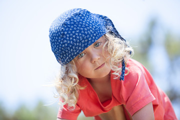 Close up portrait of adorable little child  with curly hair 