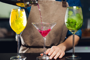 Bartender making cocktails