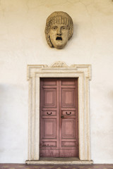 Fototapeta na wymiar Roman statue of a human face with open mouth
