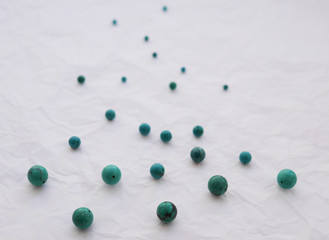 Abstract background with beads of natural stone. Beads of turquoise. Materials for handmade jewelry.
