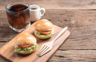 Homemade burger and Cold drink cola on wooden background