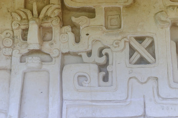 details of the frieze in stucco of the grave of a Mayan king in the acropolis of the archaeological enclosure of Ek Balam in Yucatan, Mexico.