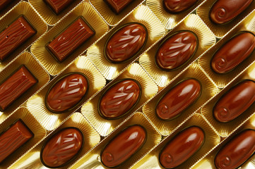 chocolate candies in a gold gift box