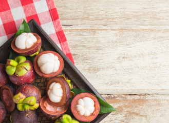 Mangosteen fruit on wooden background,top view