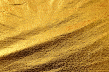 Shiny yellow leaf gold foil texture background