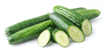 Cucumber and slices isolated over white background.