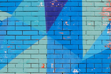 Old colorful (blue) paint with cracks on brick wall as background, texture