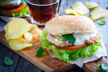 Hamburger with tomato, salad, chicken and sauce, horizontal