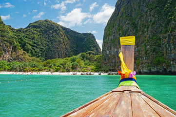 Traditional Thai Longtail boat and island of Phi Phi Leh on the horizon,Thailand