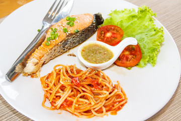Grilled Salmon steak with spaghetti tomato sauce