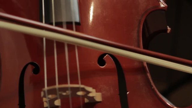 Young girl playing on the cello