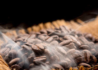 Coffee beans roasting with smoke,Selective focus