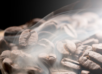 Coffee beans roasting with smoke,Selective focus