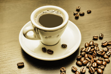 pile of coffee beans and a cup