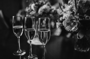 Wedding glasses and a bouquet of the bride