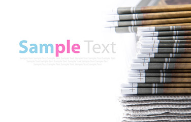 Stack of newspaper on white background