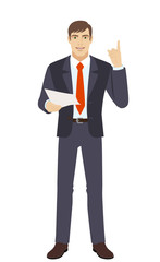 Businessman holding a paper and pointing up