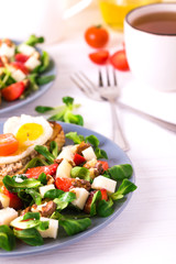 Salad with strawberry, spinach and goat cheese.  Bruschettes