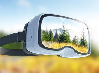 Virtual reality headset, double exposure, View of mountain peaks in spring