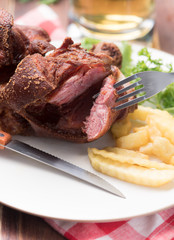 Deep Fried Pork Knuckle serve with French fried potatoes