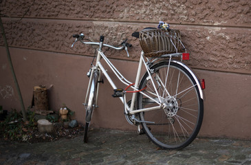 Public transport, bicycle parked at the wall