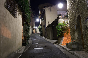 Narrow street in the old town in France at night