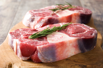 Raw meat on wooden background
